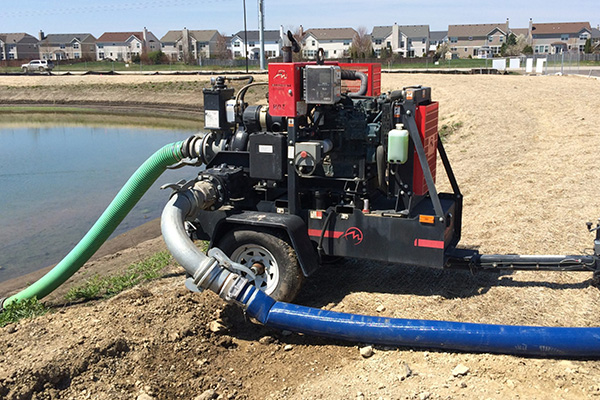 Dewatering pump draining a retention pond